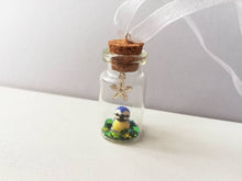 Load image into Gallery viewer, Miniature blue tit ornament. Little pottery bird in a glass bottle. Mini ornament and flower.
