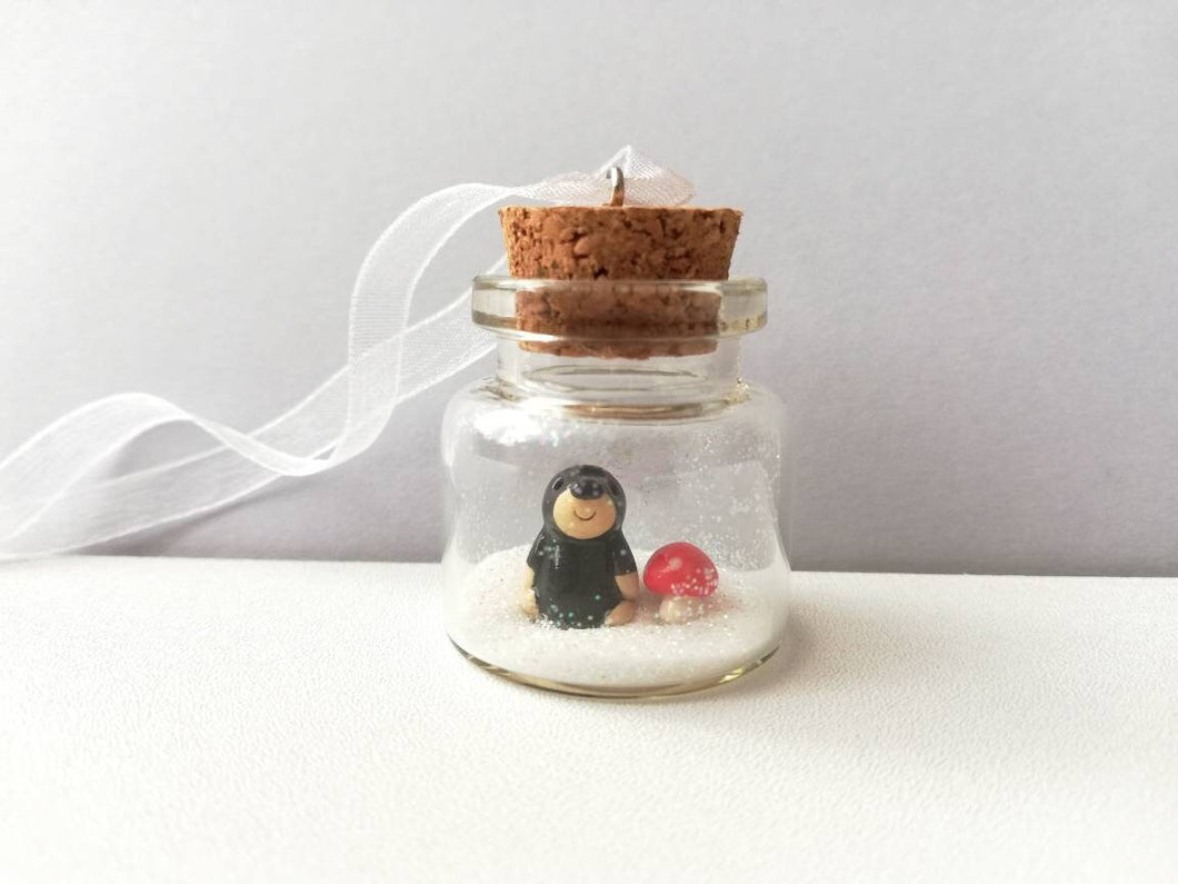 Miniature mole and red toadstool Christmas ornament. Little glass bottle and pottery mole. Christmas woodland mini ornament