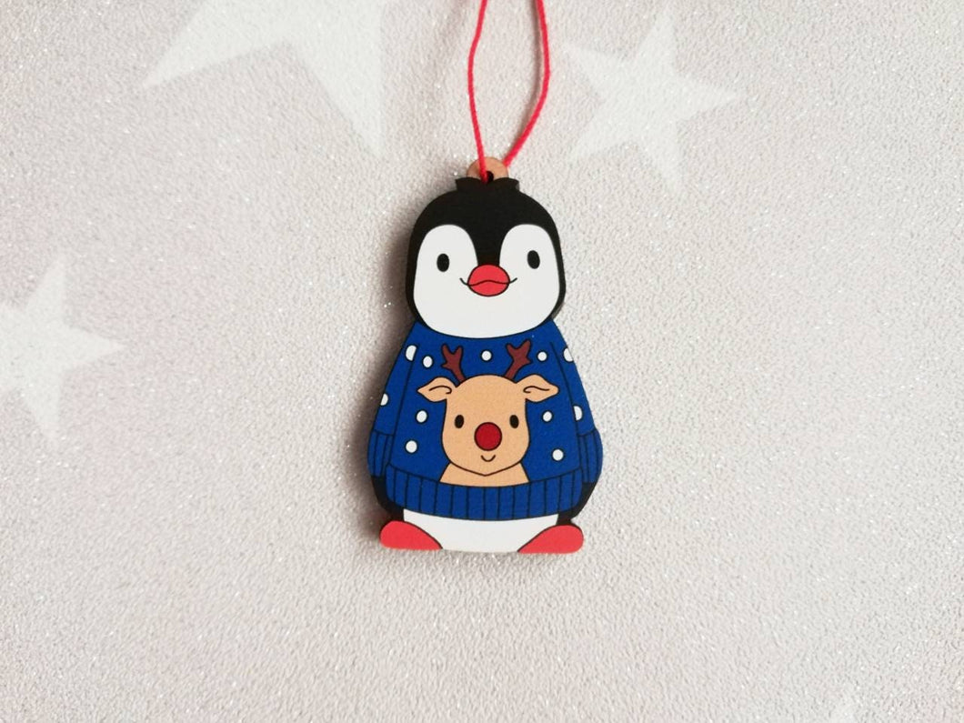 Penguin reindeer jumper decoration. Little wooden penguin wearing a blue or red jumper Christmas ornament, responsibly resourced wood