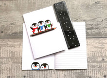 Load image into Gallery viewer, A6 notebook, cute penguins sat on a pencil. Small lined notepad
