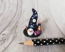Load image into Gallery viewer, Witch Wizard hat. Miniature pottery witches hat, with owl, spell books, potions and wand. Hand painted moon and stars.
