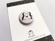 Load image into Gallery viewer, Mini button badge, two black and white penguins holding wings
