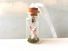 Load image into Gallery viewer, Miniature rabbit decoration. Little pottery white rabbit in a glass bottle. Mini bunny ornament and silver heart. Easter tree
