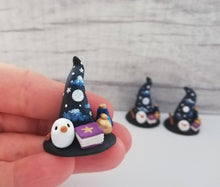 Load image into Gallery viewer, Witch Wizard hat. Miniature pottery witches hat, with owl, spell books, potions and wand. Hand painted moon and stars.

