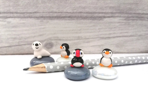 Miniature penguins, puffins and seals. Pottery and glass tiny ornament. Cute mini penguin, puffin or seal.
