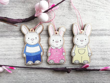 Load image into Gallery viewer, Easter bunny decorations. Set of three little wooden rabbits. Cute wooden Easter tree ornaments. Rabbit hanger, grey bunny tags.
