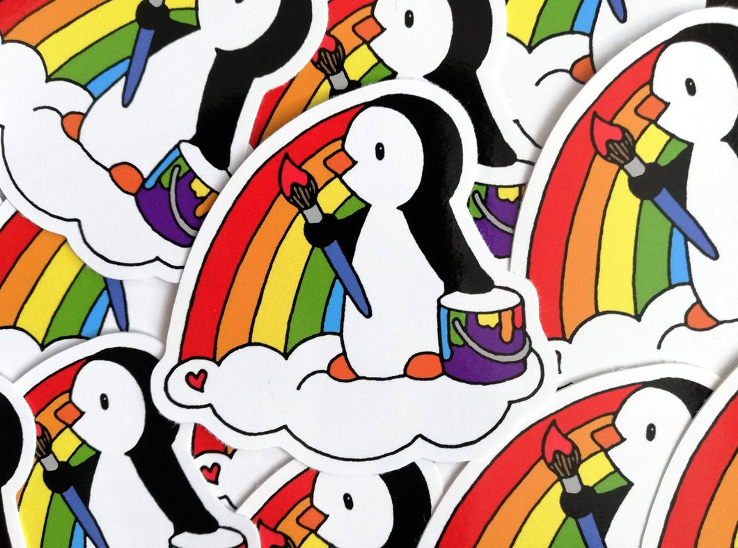 Penguin painting a rainbow vinyl sticker