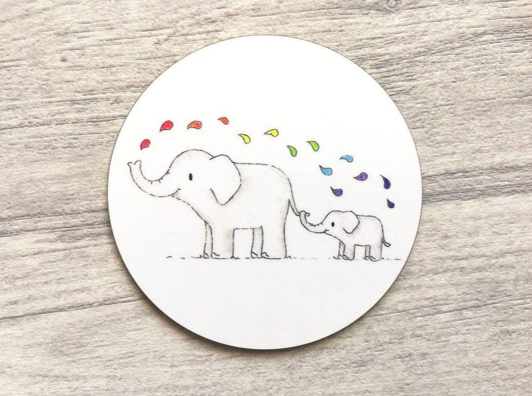 Elephant round coaster. Two elephants on a white background squirting rainbow colour drops of water from their trunk