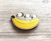 Load image into Gallery viewer, Penguin chicks and banana wooden fridge magnet
