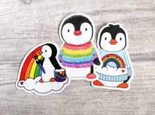 Load image into Gallery viewer, Products Set of three rainbow penguin stickers. Penguin in a rainbow jumper, painting a rainbow and boo the penguin
