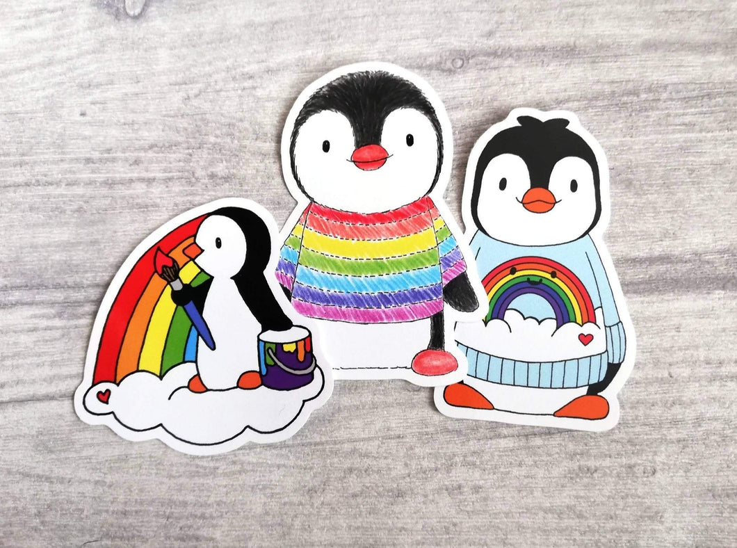 Products Set of three rainbow penguin stickers. Penguin in a rainbow jumper, painting a rainbow and boo the penguin