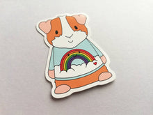 Load image into Gallery viewer, Guinea pig in a rainbow jumper,  rainbow and cloud blue sticker
