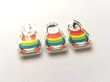 Load image into Gallery viewer, Three rainbow recycled acrylic penguin magnets
