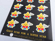 Load image into Gallery viewer, An A6 sticker sheet, with gold star for a super star written on it. There are lots of little star stickers in blue capes and red pants holding a flag saying super
