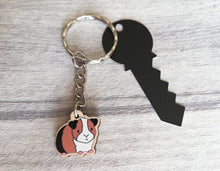 Load image into Gallery viewer, Mini guinea pig keyring, small cavy wooden key fob, ethically sourced wood, tri colour guinea pig key chain, bag charm
