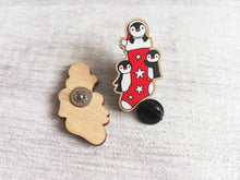 Load image into Gallery viewer, Christmas stocking pin, penguin wooden pin brooch, Responsibly resourced wood, eco friendly. Christmas penguins stocking filler
