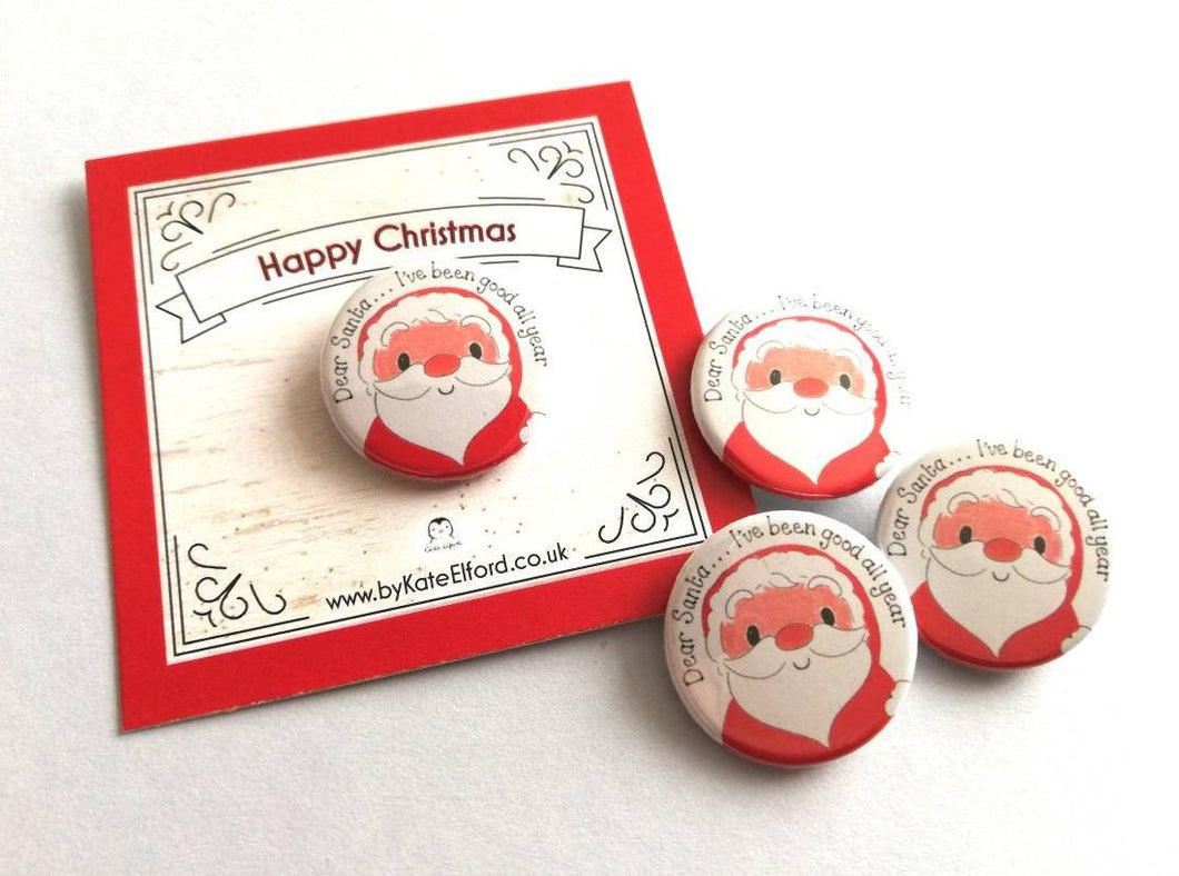 A round button badge with a drawing of Father Christmas, it has the wording Dear Santa, I've been good all year. It is mounted on a backing card that says Happy Christmas