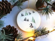 Load image into Gallery viewer, Little wooden penguin decoration. Playing in the snow Christmas ornament, eco friendly wood. Penguin chicks
