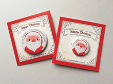Load image into Gallery viewer, Two badges small and large both with a drawing of Father Christmas, it has the wording Dear Santa, I&#39;ve been good all year. It is mounted on a backing card that says Happy Christmas
