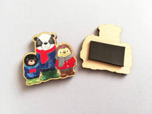 Load image into Gallery viewer, Back and front of a fridge magnet, badger, mole and hedgehog wearing coats, scarves and wellies. Woodland animals. Made from responsibly sourced, eco friendly wood

