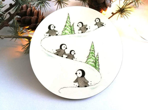 Penguin chicks playing in the snow illustrated coaster