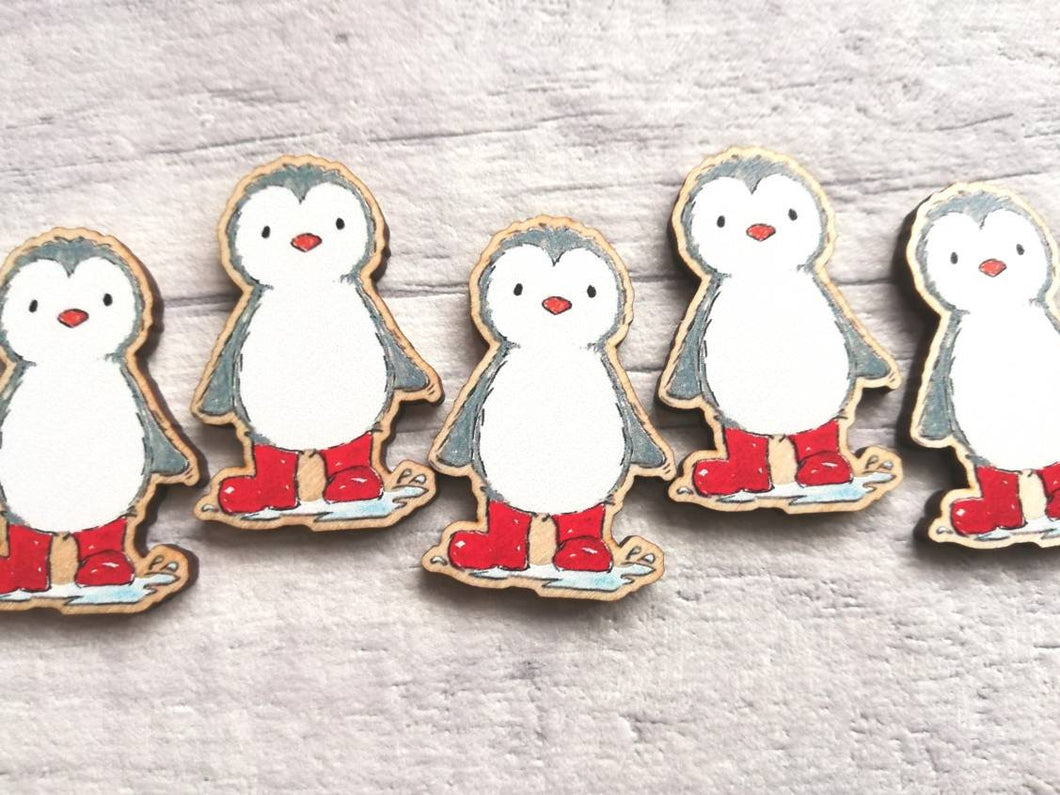 Little grey penguin magnets, wearing red welly boots