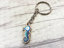 Load image into Gallery viewer, Tiny seahorse keyring, mini seahorse wooden key fob, ethically sourced wood, seaside key chain, coastal bag charm
