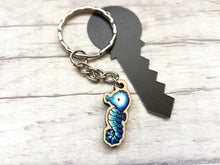 Load image into Gallery viewer, Tiny seahorse keyring, mini seahorse wooden key fob, ethically sourced wood, seaside key chain, coastal bag charm
