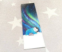 Load image into Gallery viewer, Sleeping penguin bookmark, aurora, Northern lights, penguin page marker,  bookmark, polar lights, stars, gift, book lover, book worm
