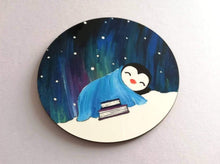 Load image into Gallery viewer, Penguin asleep in the snow, with a book and arura
