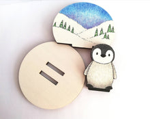 Load image into Gallery viewer, Penguin chick wooden ornament, little wood standee. Ethically sourced wood, penguin in the snow
