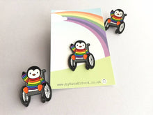 Load image into Gallery viewer, Penguin wearing a rainbow jumper, wheelchair enamel pin, penguin brooch
