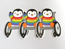 Load image into Gallery viewer, Penguin in a rainbow jumper, wheelchair vinyl penguin sticker
