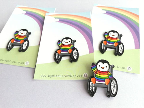 Penguin wearing a rainbow jumper, wheelchair enamel pin, penguin brooch