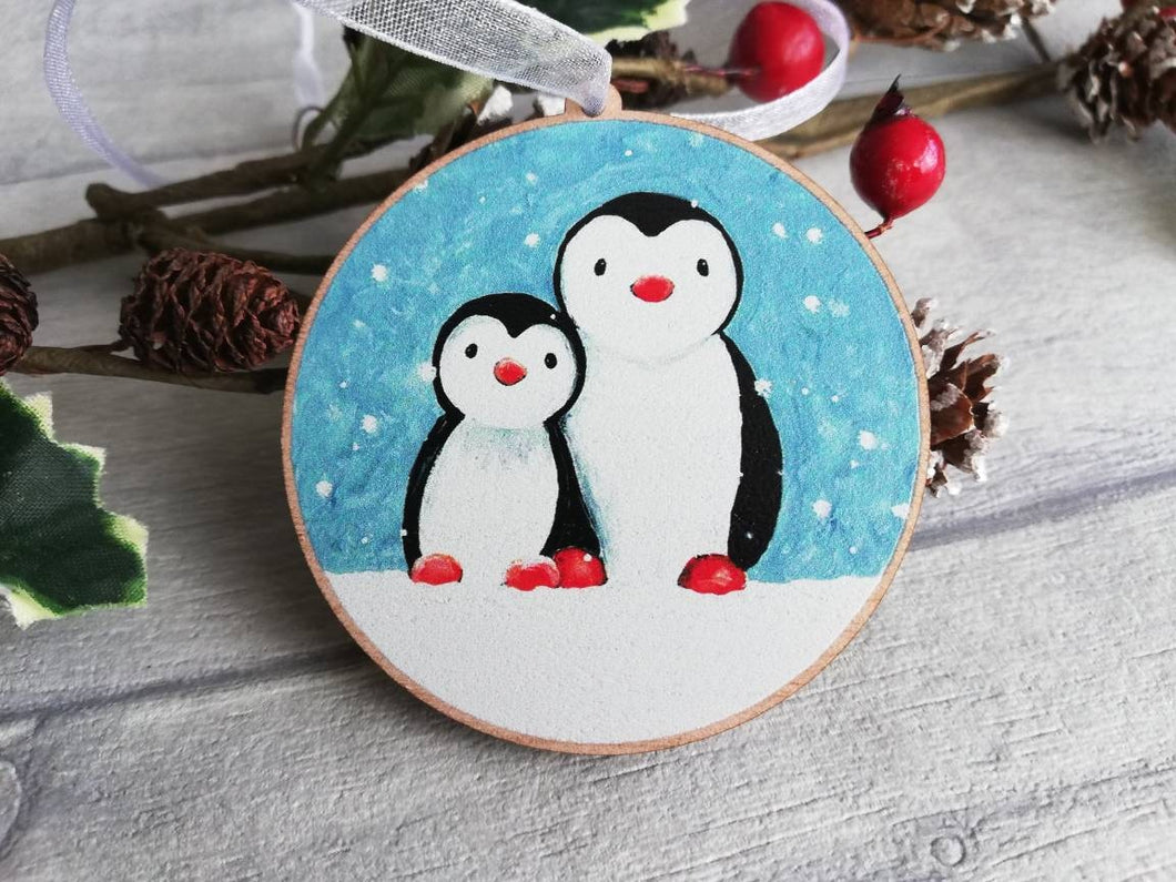 Penguin family decoration. Wooden Christmas ornament, penguins in the snow, eco friendly wood