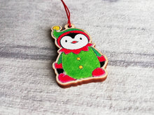 Load image into Gallery viewer, Penguin elf Christmas decoration. Small wooden elf penguin. Ethically sourced wood. Cute Christmas tree ornament
