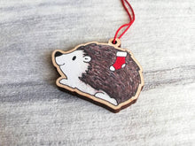 Load image into Gallery viewer, Hedgehog Christmas decoration. Hedgehog and stocking, small wooden, ethically sourced wood. Cute Christmas tree ornament
