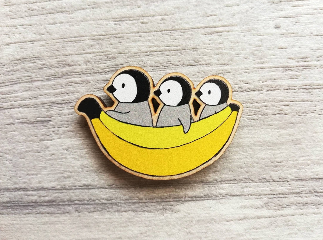 Penguin chicks and banana wooden fridge magnet