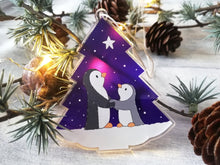 Load image into Gallery viewer, Penguin and star decoration. Eco friendly, purple recycled acrylic Christmas ornament, penguins in the snow
